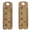 Detailed macro view of vintage alloy ruler pendants with engraved metric measurements - Antique Bronze