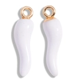 Macro shot of a pair of white enamel chili pendants with gold jumping rings on white base - White