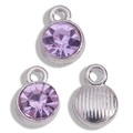 Detailed macro view of three purple round birthstone charms with silver-toned metal backing - Antique Silver Base Light Purple