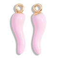 Macro shot of a pair of pink enamel chili pendants with golden metallic loops for DIY jewelry - Pink