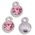 Close-up of pink crystal birthstone pendants with silver base and textured metal back - Antique Silver Base Pink