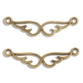 Detailed view of vintage bronze alloy wing connectors for DIY jewelry making - Antique Bronze