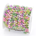 Close-up of colorful imitation pearl chain on white spool for DIY jewelry making - 4mm Beads / Mixed Colored Beads - KC Gold Chain