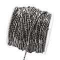 Close-up of 1.5mm gunmetal ball and bar chain on a spool for DIY jewelry making - 1.5mm / Gun Black