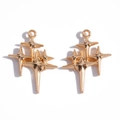 Pair of gold starburst charms for DIY jewelry making featuring multiple layered stars - KC Gold