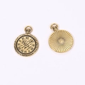 Detailed macro view of retro bronze clock charms showing roman numerals and sunburst back - Antique Gold Finish / 29 X 21 Mm / 3.1 G