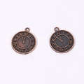 Detail showing two vintage bronze alloy clock pendants with Roman numeral engravings - Antique Red Copper Color / 21*18mm / 1.8g