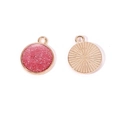 Macro shot of gold circular glitter pendants with pink resin and sunburst pattern - A4-487-round-purple/16*14mm/1.19g