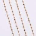 Dettaglio di catene di perline dorate sfaccettate per gioielli fai da te e accessori capelli - Metro / Oro KC