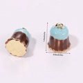 Macro view of 3D miniature Canelé charms in brown and blue with size measurements - Chocolate Cake Blue (A5-079)