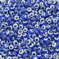 Flat round blue resin evil eye beads for DIY jewelry and bracelet making supplies - 1mm Hole / 6mm Wide / Sapphire Blue