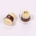Detailed macro view showing the 1.2cm 3D miniature Cannelé pendant charm dimensions - Chocolate Cake White (A5-079)