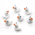 DIY white resin duck charms with orange beaks and silver metal hooks for jewelry making - White