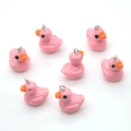 Detail view of 7 pieces of pink resin duck pendants with silver metal rings for DIY crafting - Pink
