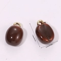 Macro view of a 3D resin coffee bean pendant with dimensions 1.3cm by 0.9cm - Coffee Bean (A5-082)