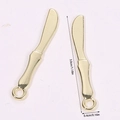 Macro view of gold butter knife pendants showing 3.0cm length and 0.4cm width dimensions - Plated Knife (A5-084)