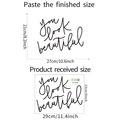 Detail showing dimensions of the 'You look beautiful' wall decal in black cursive - 23x29cm