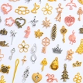 Mix of 100 assorted vintage alloy charms in gold, silver, and bronze for DIY jewelry making - Random Mixed Colors