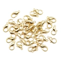 Close-up of golden zinc alloy lobster clasps for DIY jewelry necklace making - KC Gold