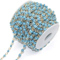 Macro shot of gold chain with blue evil eye beads for DIY jewelry making material - Sky Blue Eye KC Gold Chain