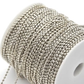 Close-up of polished silver metal ball bead chain on a white plastic spool for DIY jewelry - 3.0mm / White Gold