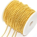 Macro view of bright golden ball chain neatly wound on a spool for DIY jewelry crafts - 3.0mm / Imitation Gold
