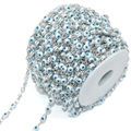 Macro shot of silver evil eye chain roll for DIY jewelry making and necklace crafts - 5mm Eye / White Eye Silver Chain