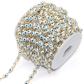 Detail of evil eye chain roll with blue enamel beads and gold-plated copper links - 5mm Eye / White Eye KC Gold Chain