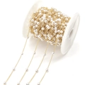 Detailed macro view of white pearls on golden metal chain roll for DIY jewelry design - 4 mm / KC Gold