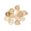 Macro view of gold alloy zodiac charm pendants with engraved symbols for DIY jewelry - Aries / KC Gold
