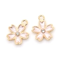 Pink enamel cherry blossom pendant charms with gold edges and central crystal stone - White