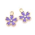 Detailed view of two purple enamel cherry blossom alloy pendants with inlaid zircons - Purple