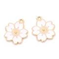 Macro shot of white enamel cherry blossom pendants with golden alloy details for DIY jewelry - White (6174957043421)
