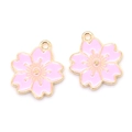 Detail view of two light pink enamel cherry blossom pendants with gold metal edges for DIY - Pink (6174957043420)