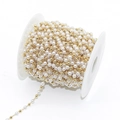 Roll of white faux pearl and gold bead chain on a spool for DIY jewelry crafts - Gold Tone (A3-389)