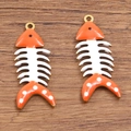 Orange and white enamel fishbone charms made of stainless steel for DIY jewelry making - 1 Piece / Orange