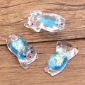 Luminous blue resin sleeping cat charm with glitter for DIY necklaces and crafts - Blue