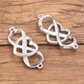 Silver infinity heart pendants in polished and zircon-set stainless steel on wood - Infinity Heart Style (992) / 16X36mm / Steel
