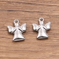 Juego de dos colgantes de alas de ángel en acero inoxidable plateado pulido para joyas - 10x12mm / Plateado
