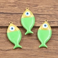 Three fish shaped stainless steel charms with evil eye enamel in gold plating - 1 Piece / Light Green