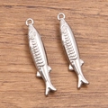 Polished silver 304 stainless steel fish charm with detailed scales and top ring - 6x30mm / No.2 Fish Steel Color
