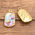 Golden stainless steel enamel ocean pendant with purple pearl inlay and hammered texture - Long Conch with Purple Pearl