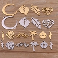Assorted gold and silver stainless steel DIY jewelry charms with moon and tree shapes - Multicolor
