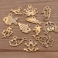 Golden stainless steel ocean animal pendants featuring octopus, seahorse and dolphin designs - Gold