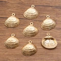 Set mit sieben goldenen Muschel-Anhängern aus Legierung für die Schmuckherstellung - Muschelform (Nr. 17) / 18*19mm / Gold