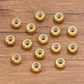 Perle distanziatrici tonde dorate in acciaio inossidabile con texture a spirale - 6x1.2mm / Oro