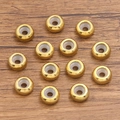 Goldene runde Edelstahl-Abstandshalter mit strukturierter Oberfläche und Silikonkern - 10x3mm / Gold