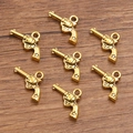 Vintage gouden revolver hanger voor DIY-sieraden met ster detail op het handvat - Nr.3 Antiek Goud