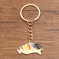 Gold graduation keychain featuring a mortarboard cap and colorful books on wood - Style 4 (19X35mm)