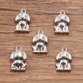 Front and back view of silver dog shaped charm pendant in 304 stainless steel - 1598 Steel Color (8X12mm)